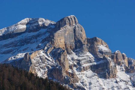 Dolomite massif during winter time with snow covered mountain peak of Cima Cunturines at nature park Fanes-Sennes-Prags, South Tirol, Italy