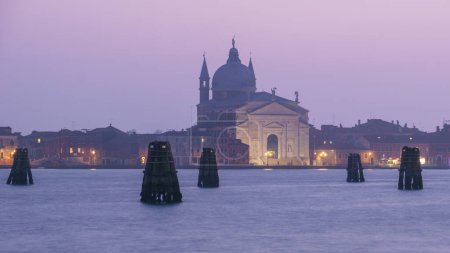 Il Redentore church on Giudecca island on a hazy winter evening during blue hour, Venice, Veneto, Italy