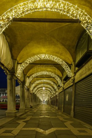 Archway in Christmas lights on San Marco Square in Venice, Veneto, Italy