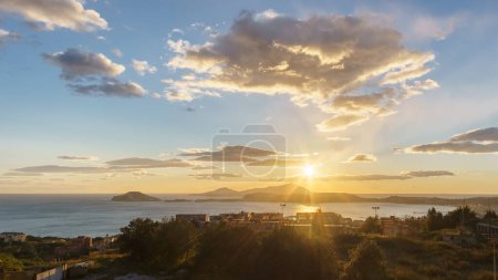 Photo for Golden sunset over the sea of Gulf of Naples at Campi Flegrei with island seen from above the Solfatara, Pozzuoli, Campania, Italy - Royalty Free Image