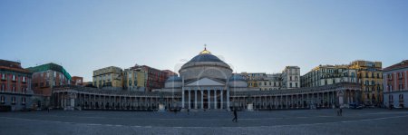 Photo for Cityscape of town square Piazza del Plebiscito with Basilica San Francesco di Paola under a clear blue sky, Naples, Campania, Italy - Royalty Free Image