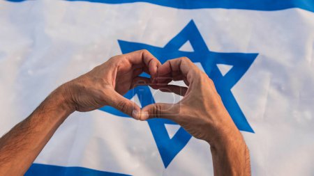 Photo for Hand in heart shape on Israel flag. - Royalty Free Image