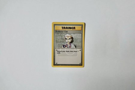 Photo for Prague, Czech Republic - April 3 2022: Professor Oak trainer card from first set of Pokemon cards. The Pokemon Trading Card Game is a collectible card game based on Nintendos Pokemon franchise. - Royalty Free Image