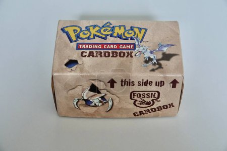 Photo for Prague, Czech Republic - April 3 2022: Fossil themed card box for Pokemon cards. The Pokemon Trading Card Game is a collectible card game based on Nintendos Pokemon franchise. - Royalty Free Image