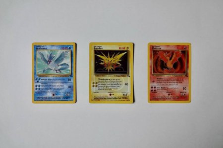 Photo for Prague, Czech Republic - April 3 2022: Articuno, Zapdos and Moltres cards front from fosil edition. The Pokemon Trading Card Game is a collectible card game based on Nintendos Pokemon franchise. - Royalty Free Image
