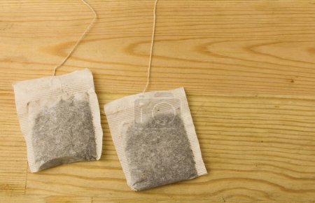 Teabag Isolated on wooden background.
