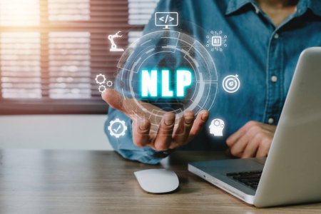 Photo for NLP natural language processing cognitive computing technology concept, Business person hand holding VR screen NLP icon on office desk, AI Artificial intelligence. - Royalty Free Image