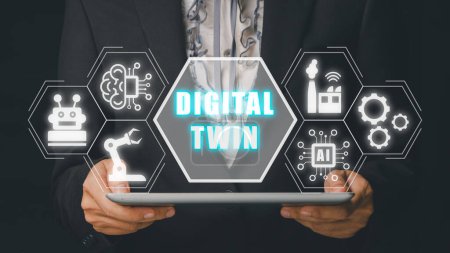 Foto de Digital twin business and industrial process modelling, Business woman using tablet with digital twin icon on virtual screen, innovation and optimisation. - Imagen libre de derechos