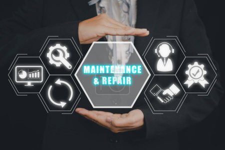 Photo for Maintenance and repair concept, Business person hand holding Maintenance and repair icon on virtuals screen. - Royalty Free Image