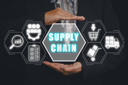 Supply chain management concept, Business person hand holding supply chain icon on virtual screen.