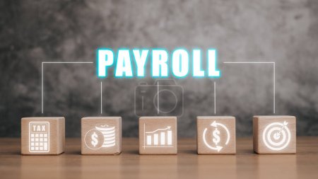 Payroll business finance concept, Wooden block on desk with Payroll icon on VR screen, Financial, accounting.
