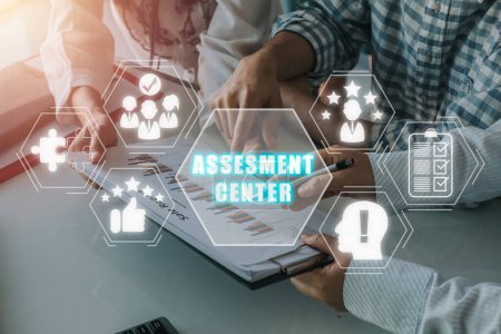 Photo for Assesment center concept, Business team working on business paper with assessment center icon on virtual screen. - Royalty Free Image