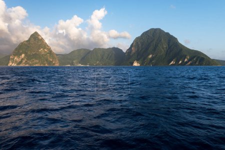 The Pitons are volcanic spires which are located on St. Lucia in the West Indies. Petit Piton is 743 meters (2,438 feet) and Gros Piton is 799.meters (2,618 feet). 