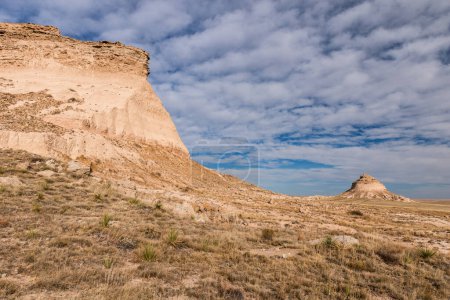 Photo for Part of a two mile trail used by visitors to view the Pawnee Buttes. Dramatic landmarks that can be viewed from many different angles. It is a warm Autumn day which is nice to do recreational trail walking on the Pawnee National Grasslands. - Royalty Free Image