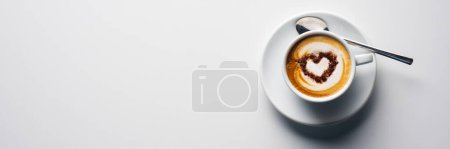 Photo for Top view coffee cup with heart shape decoration. on white background. banners - Royalty Free Image