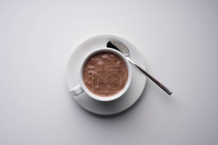 Photo for Top view hot chocolate in cup. White background - Royalty Free Image