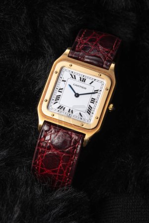 Photo for Milan Italy November 9, 2023. Cartier Santos Dumont model luxury watch in yellow gold. Dark background - Royalty Free Image