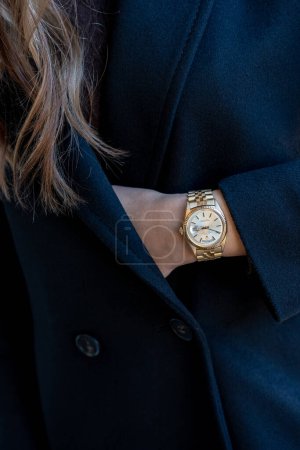 Photo for Milano Italy_ November 9 2023. Rolex Day Date watch with gold strap, worn on a female wrist - Royalty Free Image