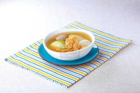 Photo for Sun Moon Fish, Huaishan Festival Melon and Pork Tendon Soup served in a bowl isolated on napkin side view of hong kong food - Royalty Free Image