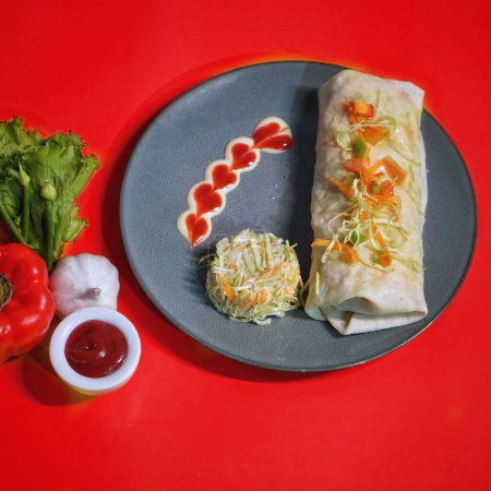 Photo for Burrito shawarma rolll with salad and dip served in dish top view of fastfood - Royalty Free Image