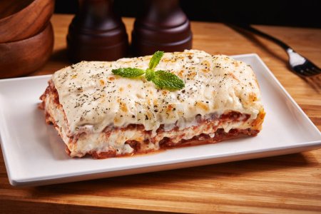 Photo for Beef Lasagna served in dish isolated on table side view of middle east food - Royalty Free Image
