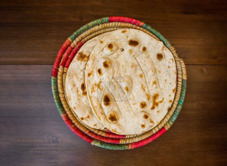 Photo for Tandoori roti served in basket isolated on table top view of india and pakistani food - Royalty Free Image