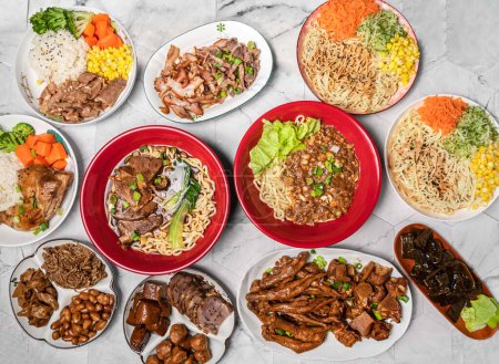 Photo for Assorted Braised beef noodles, Meat, Donburi, Flax and Pesto Cold Noodles, kelp, chicken feet, Chicken Bento, peanut, dried tofu, pig feet served in dish isolated on table top view of taiwan food - Royalty Free Image