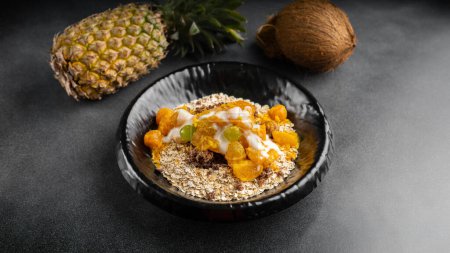 Foto de Whole grain oatmeal with rapid protein resource and our special tropical fruits sauce served in dish isolated on table top view of arabic food - Imagen libre de derechos