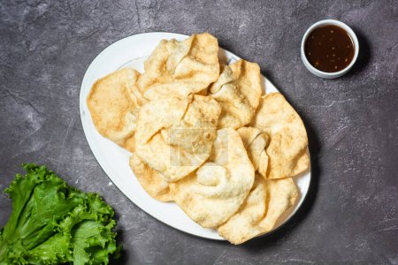 Photo for Fried Wonton or woonthon and sauce served in dish isolated on grey background top view of indian and bangladesh food - Royalty Free Image