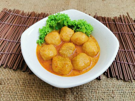Curry Fish Ball served dish isolated on table top view of thai food