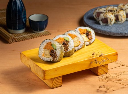 Photo for Japanese classic roll served isolated on wooden board top view of japanese food - Royalty Free Image