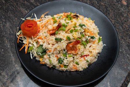 Photo for Mixed fried rice with chicken, shrimp, prawn, egg, carrot, spring onion and peas served in dish isolated on background top view of bangladesh and indian food - Royalty Free Image