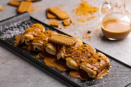 Photo for Lotus Roll pancake served in wooden board isolated on background top view of cafe baked food - Royalty Free Image