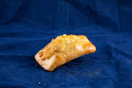 Photo for Beef Roll isolated on blue background side view of savory snack food - Royalty Free Image