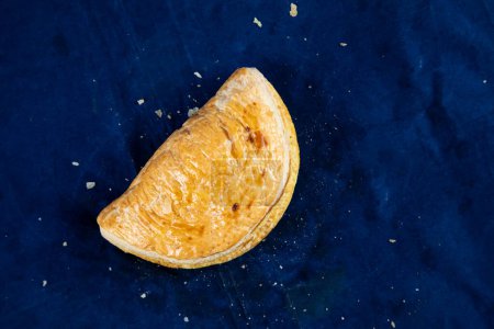 Photo for Beef Patties isolated on blue background top view of savory snack food - Royalty Free Image