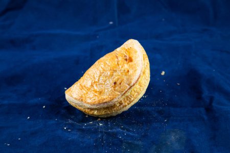Photo for Beef Patties isolated on blue background side view of savory snack food - Royalty Free Image
