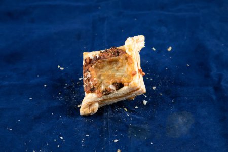 Photo for Beef Bacon Puff isolated on blue background side view of savory snack food - Royalty Free Image