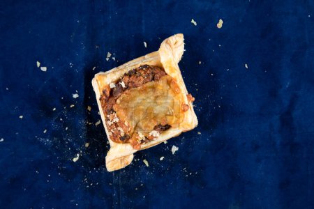 Photo for Beef Bacon Puff isolated on blue background top view of savory snack food - Royalty Free Image