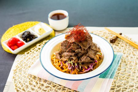 Photo for Sichuan Spicy Braised Beef with Fish Udon with chopstick served in bowl isolated on napkin side view of japanese food on table - Royalty Free Image
