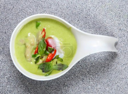 Photo for Chicken green curry with tomato served in dish isolated on grey background top view of hong kong food - Royalty Free Image