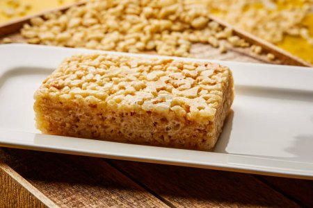 Photo for Salted Rice Krispie treats Bar served in dish isolated on wooden table top view of arabic sweet dessert - Royalty Free Image