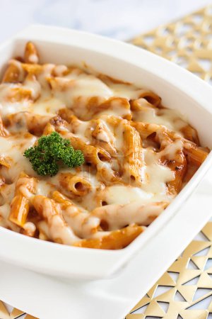 PENNE ROSE PASTA with cheese Served in dish isolated on table closeup top view of italian food