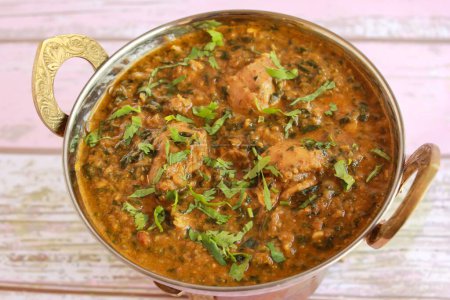 Chicken Palak Korma Masala Gravy served in karahi isolated on table closeup top view of indian spices food