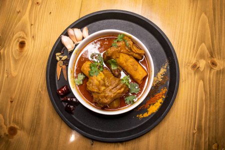 Beef Nali Nihari or Nolar Jhol served in dish isolated on wooden background top view indian spices, bangladeshi and pakistani food