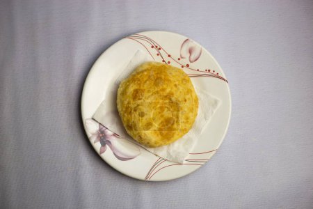 Fried Keema puri served in plate isolated on background top view of bangladeshi, indian and pakistani traditional spicy food