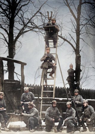 Photo for Germany, - Circa 1915: Colorized Restored Photography. German observers soldiers during World War I.German observers soldiers posing and looking at the camera on a ladder and one using a binocular trench periscope during World in the eastern front. - Royalty Free Image