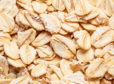 Photo for Rolled oats or oats flakes heap close up. - Royalty Free Image