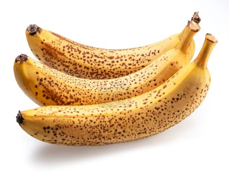 Bananen mit schwarzen Flecken bei der Auswahl ihrer Süße isoliert auf weiß.