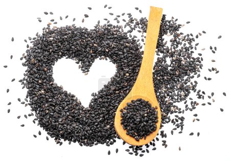 Photo for Black cumin seeds arranged in shape of heart isolated on white background. Top view. - Royalty Free Image