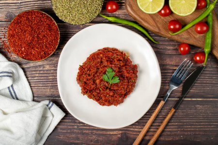 Photo for Hot chili peppers harissa sauce. red chili paste or adjika. Top view - Royalty Free Image